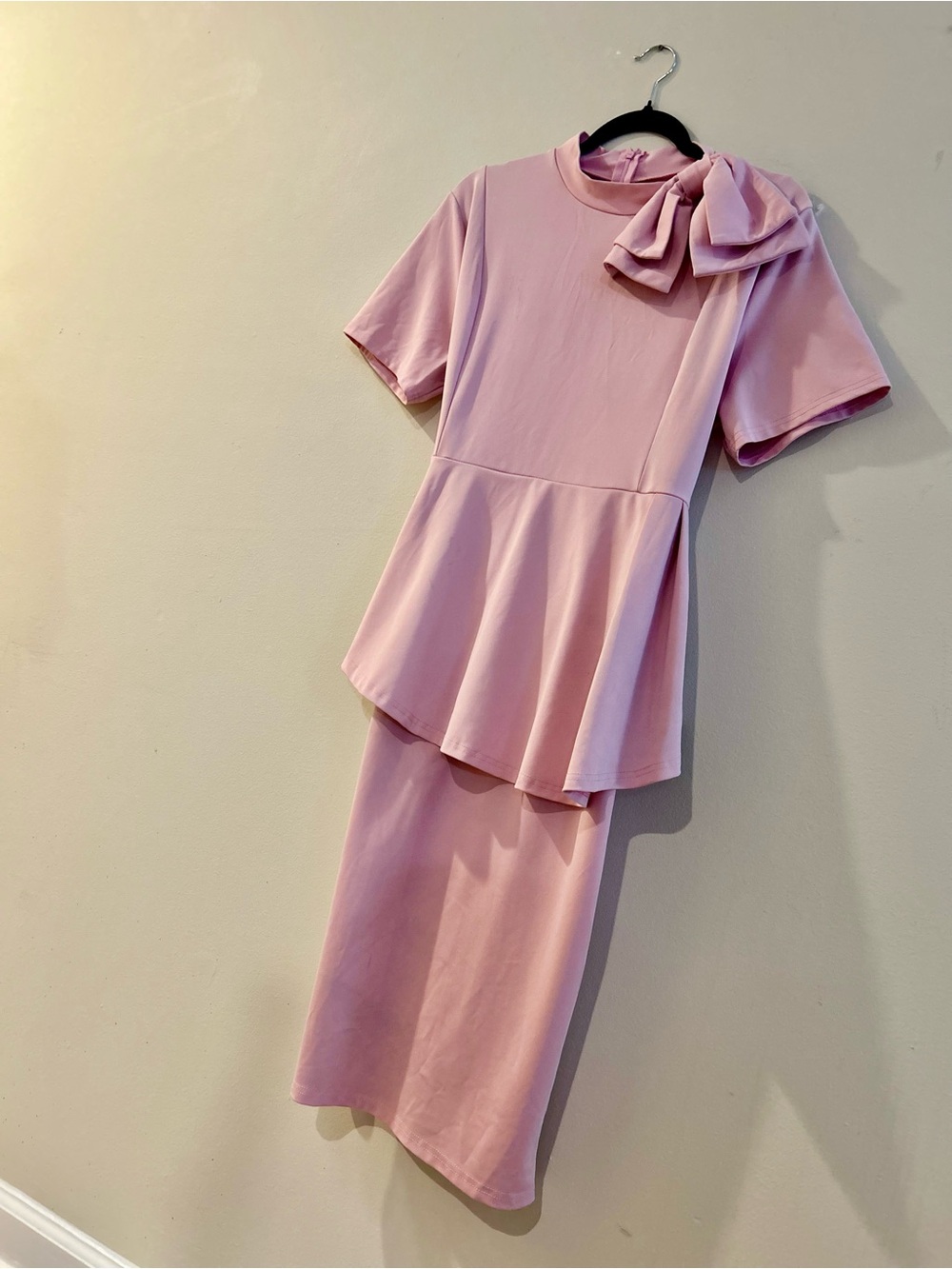 Elegant Pink Peplum Dress with Bow Accent